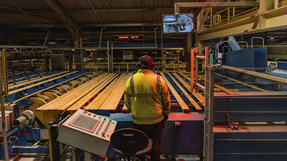 Operator overseeing the sawmill production line at GP Wood