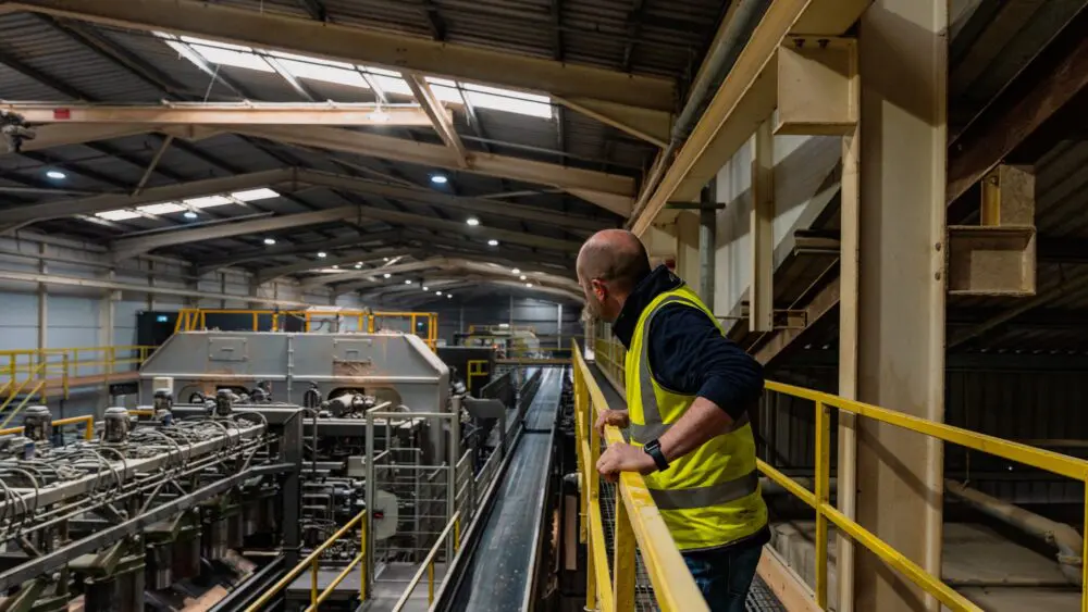 GP Wood employee on an elevated platform overseeing the sawmill