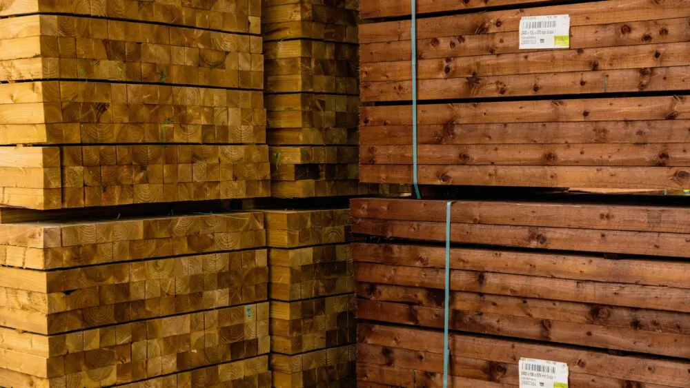 Stacked packs of pressure-treated timber at GP Wood
